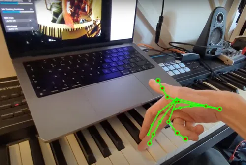 Hand Tracking skeleton overlaid on hand playing piano