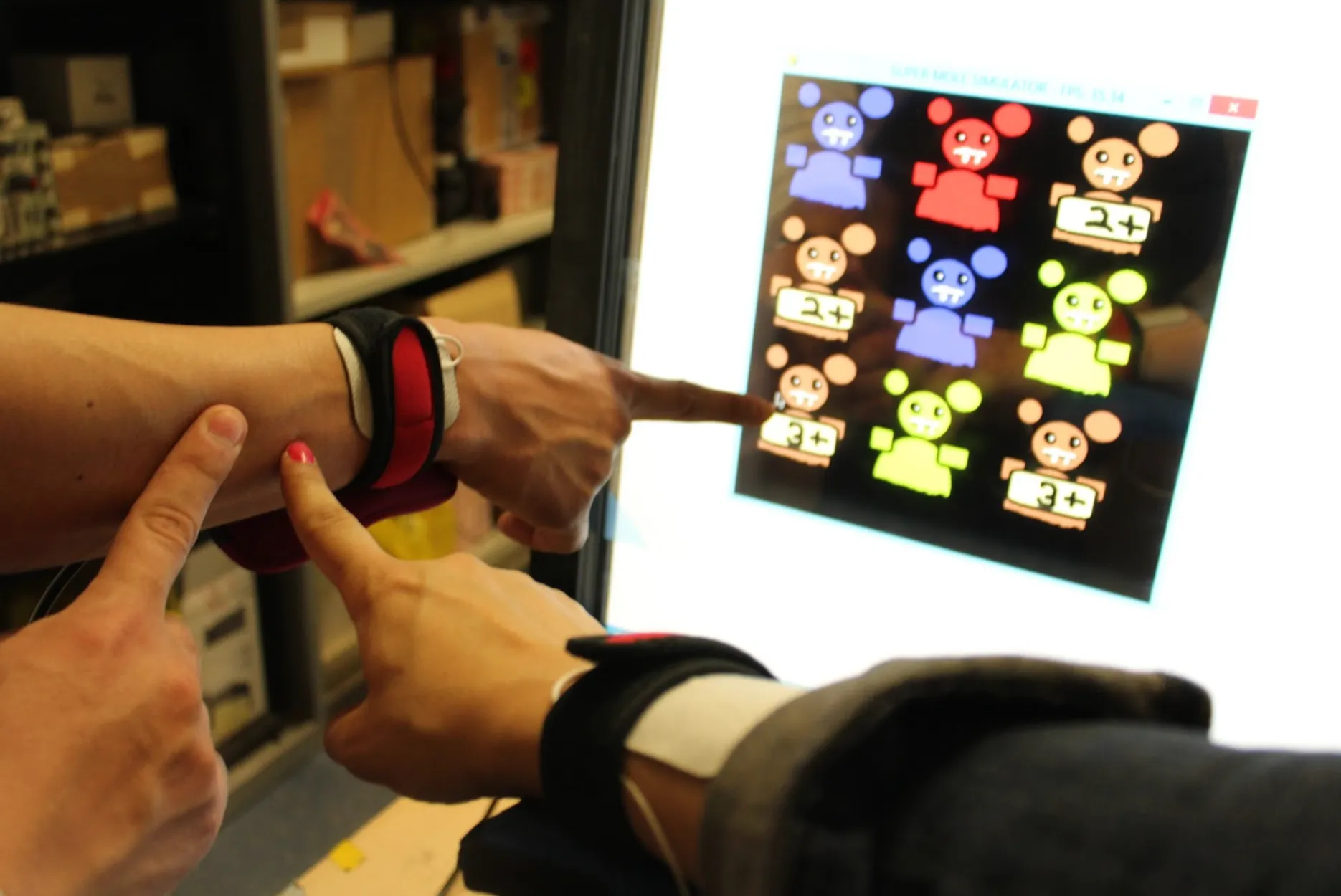 whack a mole game with 3 users required to touch moles labelled 3+